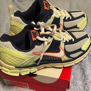 Nike Vomero 5 Kids Sneakers - White, Navy, Neon with a hint or tangerine.